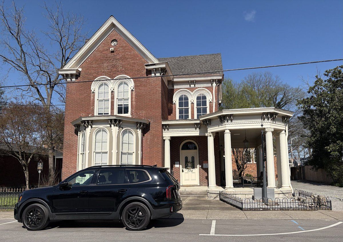 A restored 19th-century brick home on a street in downtown Franklin, Tennessee.